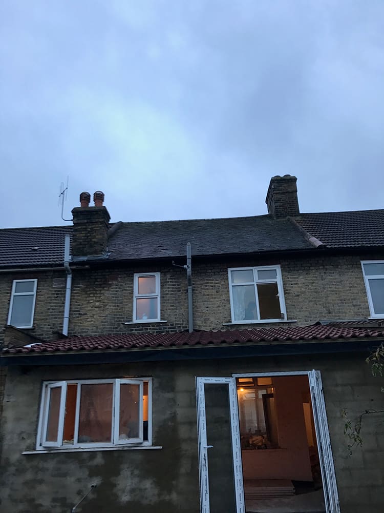 London terrace rooflines and chimney stacks at dusk
